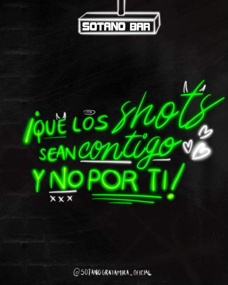 Disfruta momentos divertidos y espontáneos con amigos en un bar subterráneo moderno con señalización de neón y ambiente acogedor, ideal para eventos y reuniones sociales.