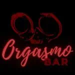 Crystal clear, red skull-shaped sunglasses on a black background, trendy bar style, neon lighting, modern urban vibe.