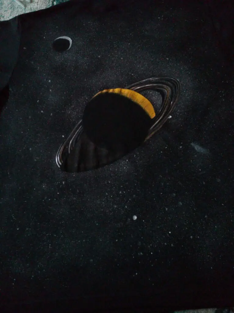A nebula of dust and gas with a star-forming disk in space, representing scientific exploration and notable astronomical events.