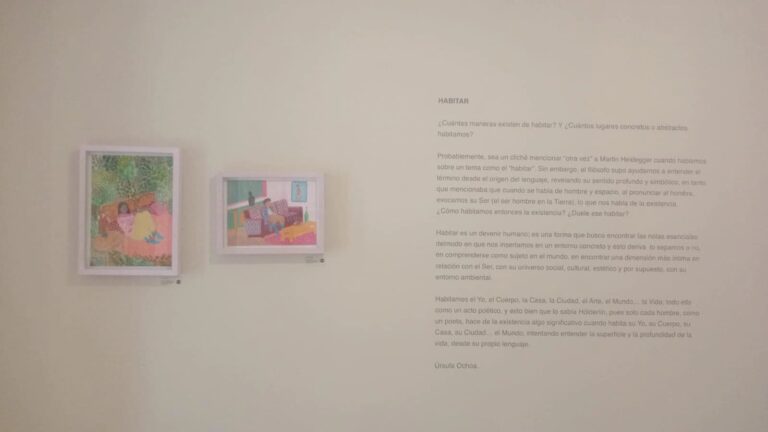 Colorful art exhibition at eventoiro.co featuring contemporary illustrations on a gallery wall.