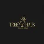 圣诞树上装饰着 Tree Haus Social Club 的标志，标志是一只戴着帽子的猫头鹰，风格简约，以金色为主色调，背景为黑色。