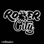Rocker City 的标志在黑色背景的衬托下格外醒目，代表了哥伦比亚音乐界的都市风格和文化。这款现代且引人注目的设计旨在推广摇滚活动和摇滚社群。