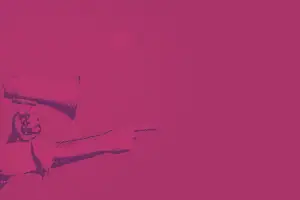 Audience participating in a business event with a microphone and presenter, focusing on networking and conferences.