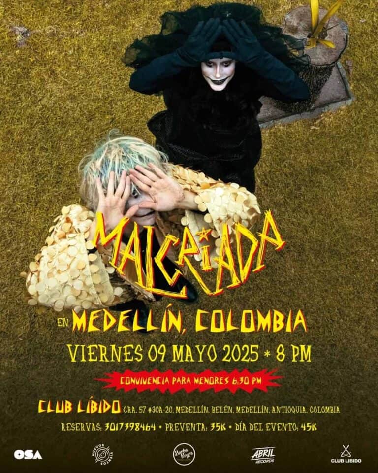 Tradicional hotel en Medellín, Colombia, con un cartel promocional de concierto con personajes de temática teatral, detalles de evento y reservaciones. Perfecto para promover eventos culturales en Medellín.