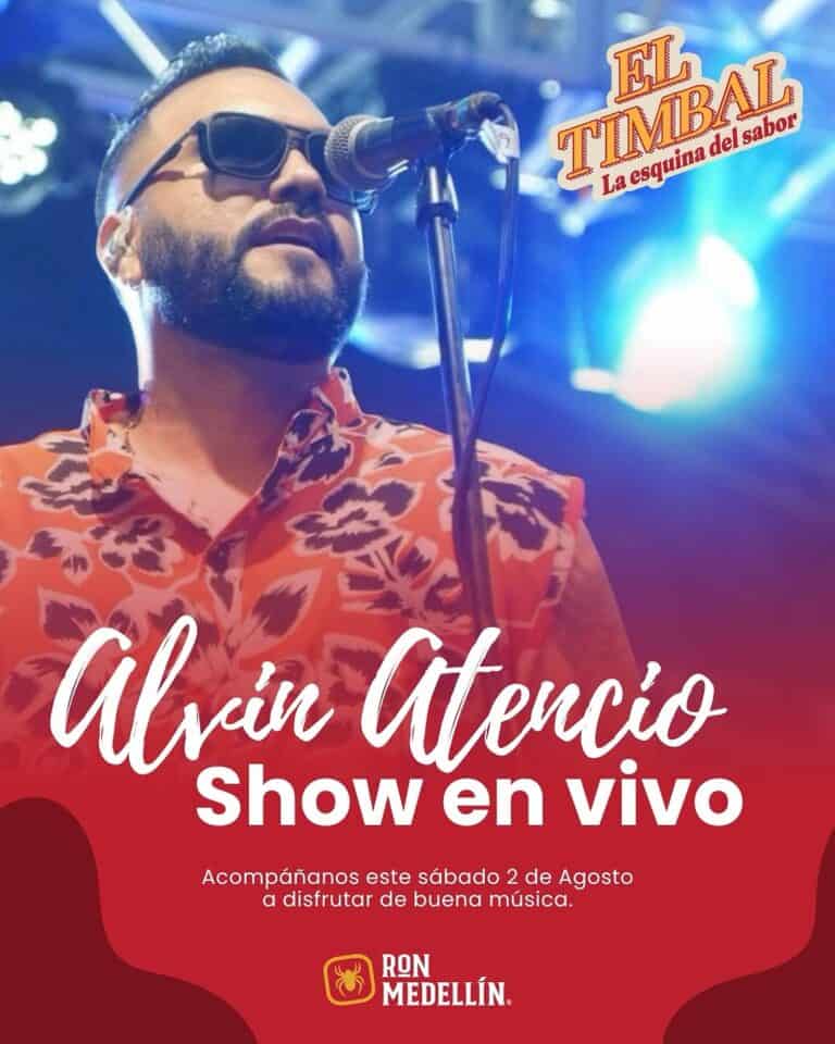 Alvín Atencio en vivo, cantante y artista presentando show musical en evento en Medellín con iluminación y escenario vibrante.