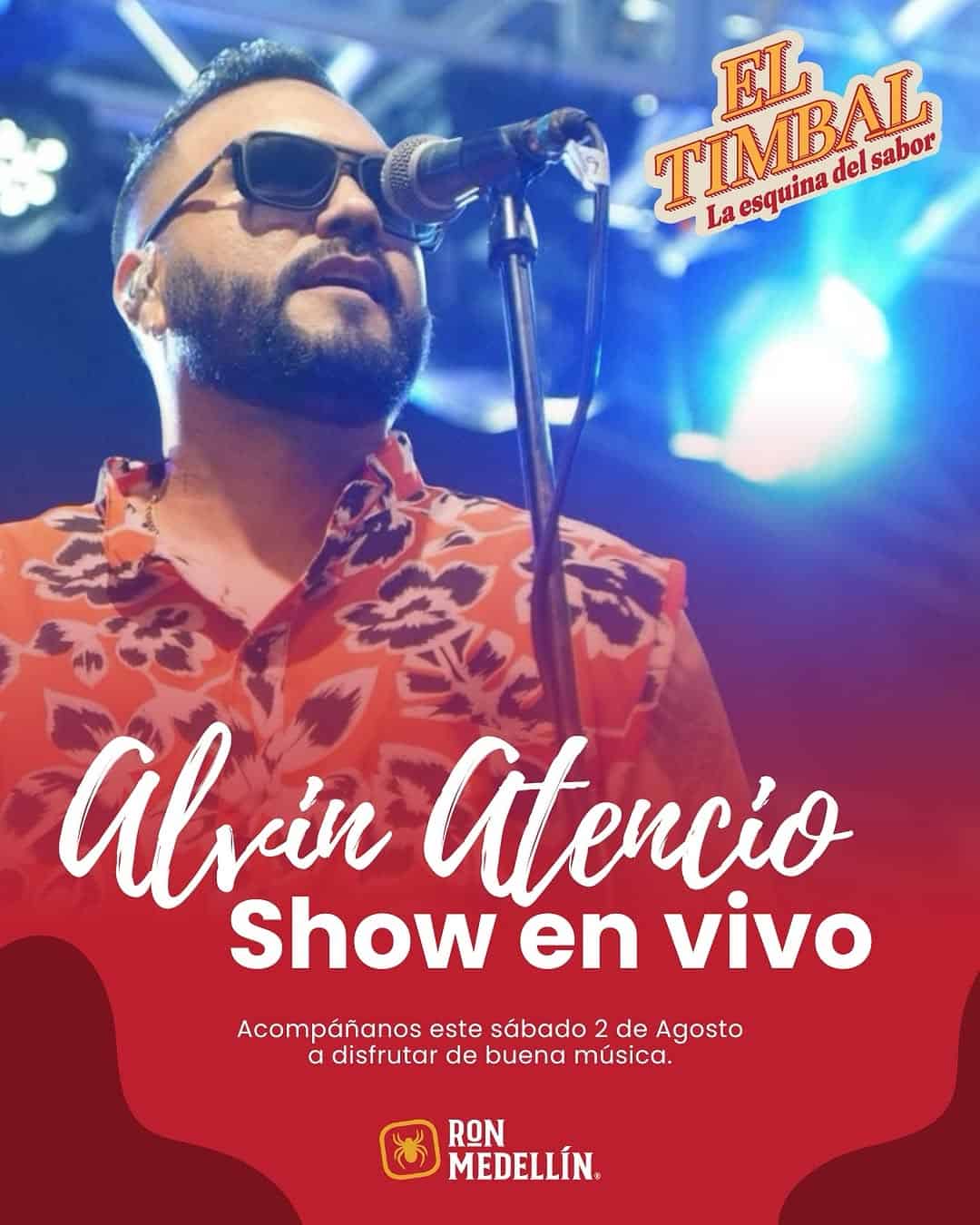 Alvín Atencio en vivo, cantante y artista presentando show musical en evento en Medellín con iluminación y escenario vibrante.