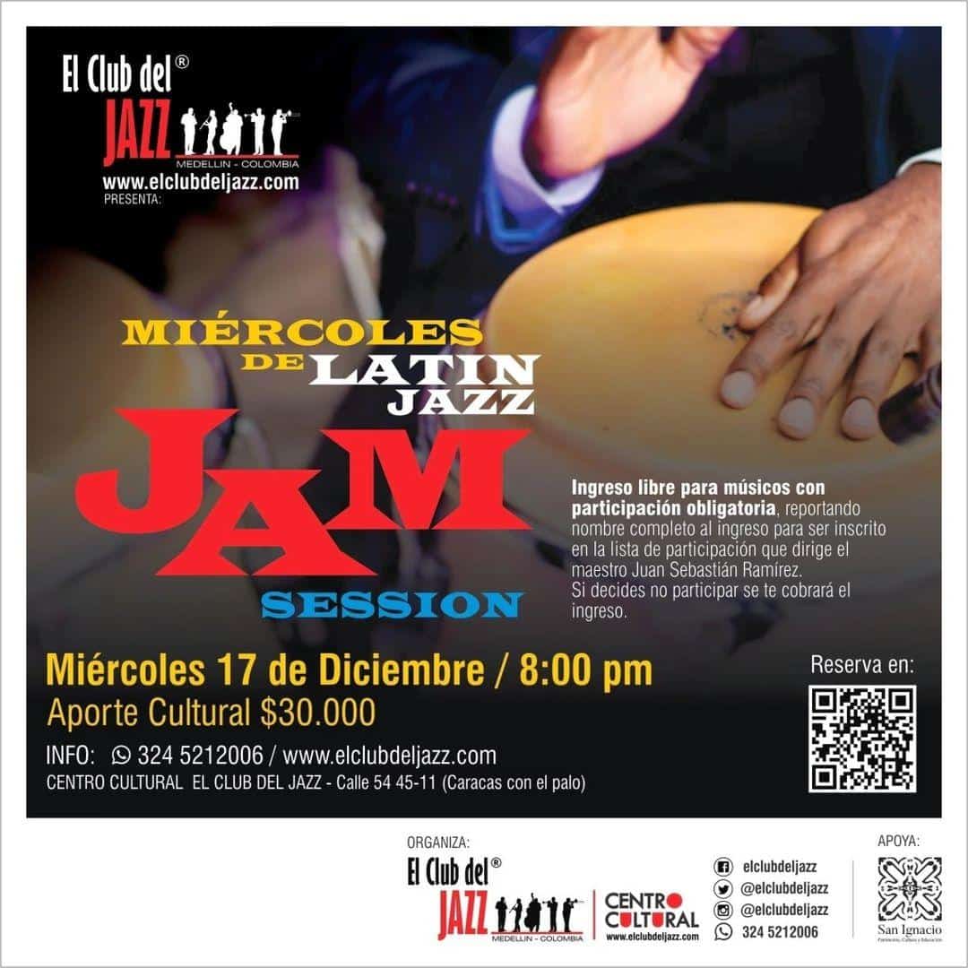 Fotografía de un músico tocando un instrumento de percusión en un evento de jazz con logotipos y detalles del evento.