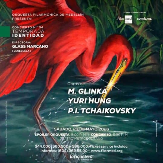 Imagen de un pintoresco concierto en Medellín con orquesta y artistas internacionales, promoviendo eventos culturales y musicales en la ciudad.